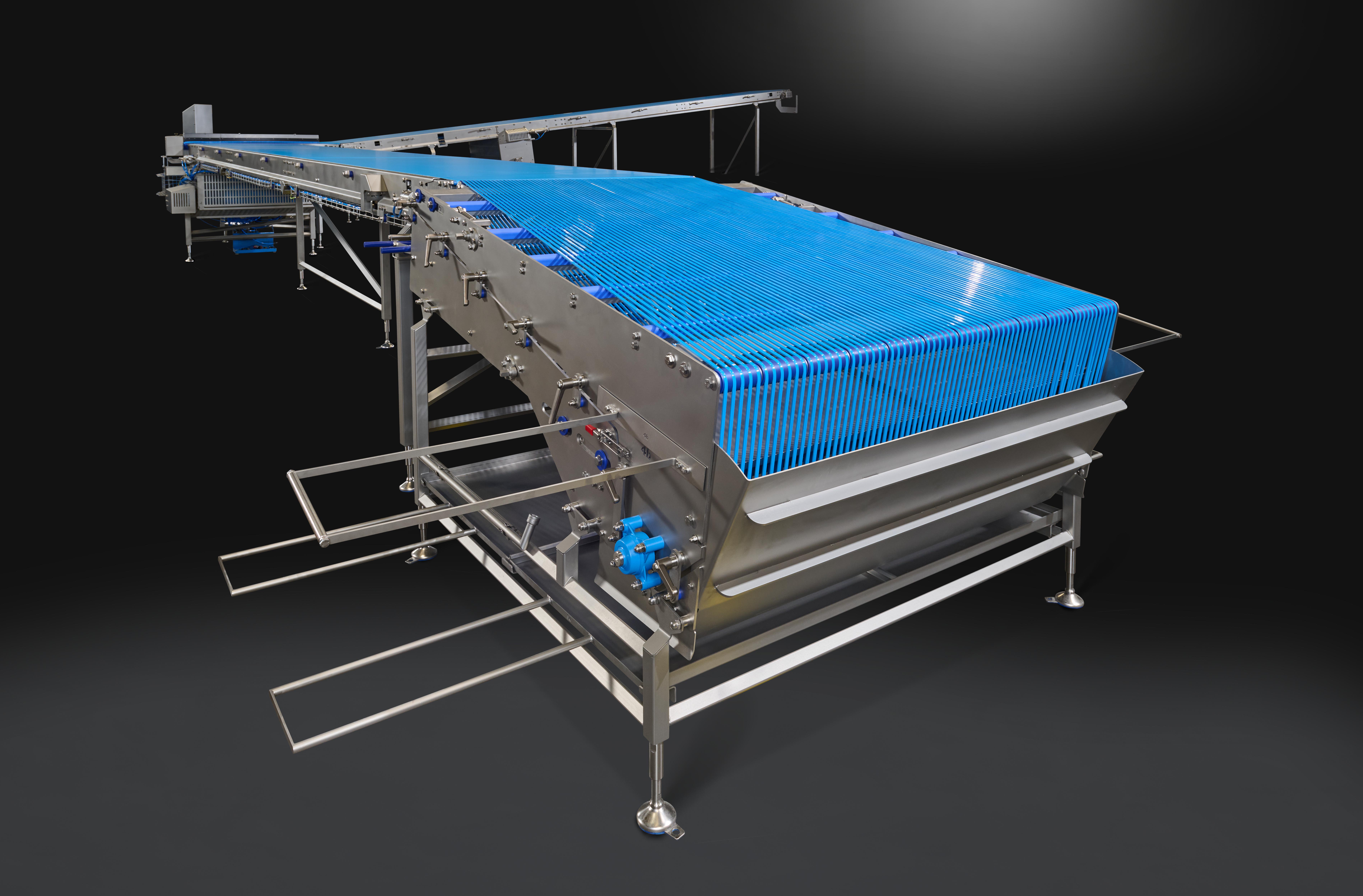 Flat belt spreader