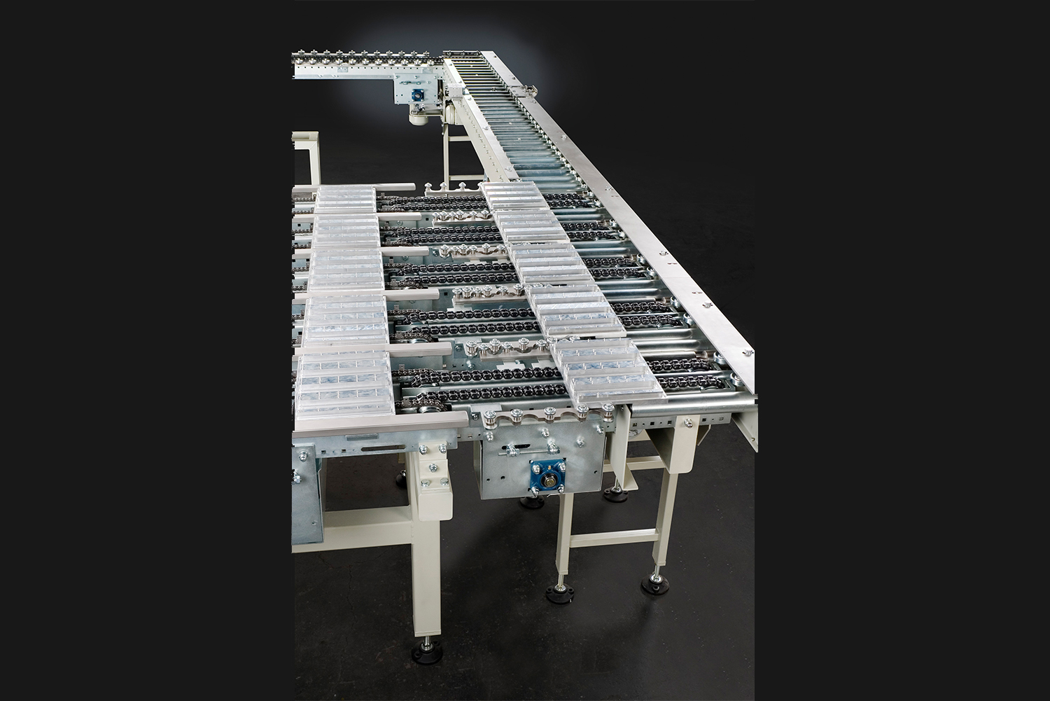 Transfer track for workpiece carriers